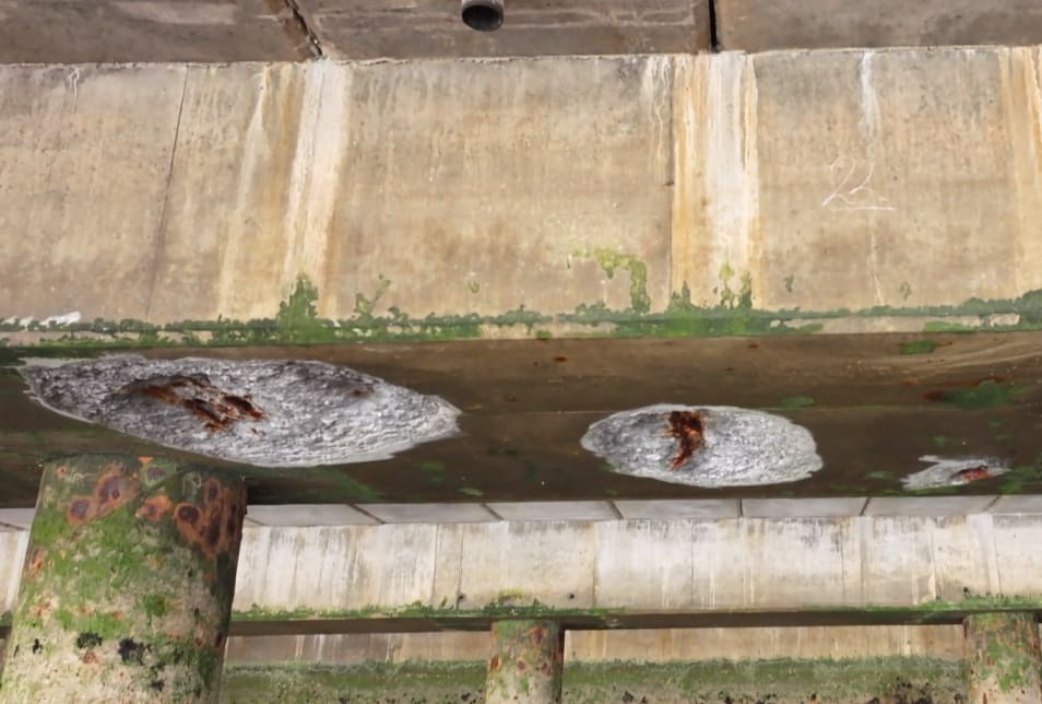 you can see clear defects already in the concrete where it has come away and you can see the steel reinforcing underneath