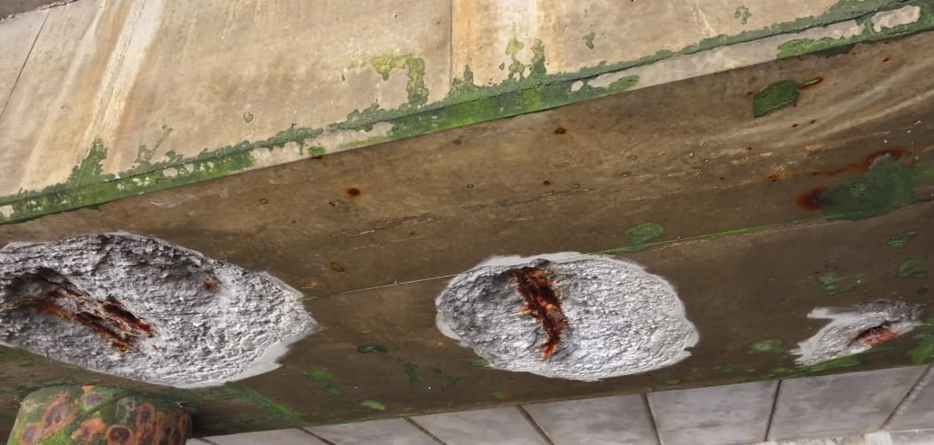 Clean view of the underside beam structure showing proper lighting technique with good detail capture of the concrete surface