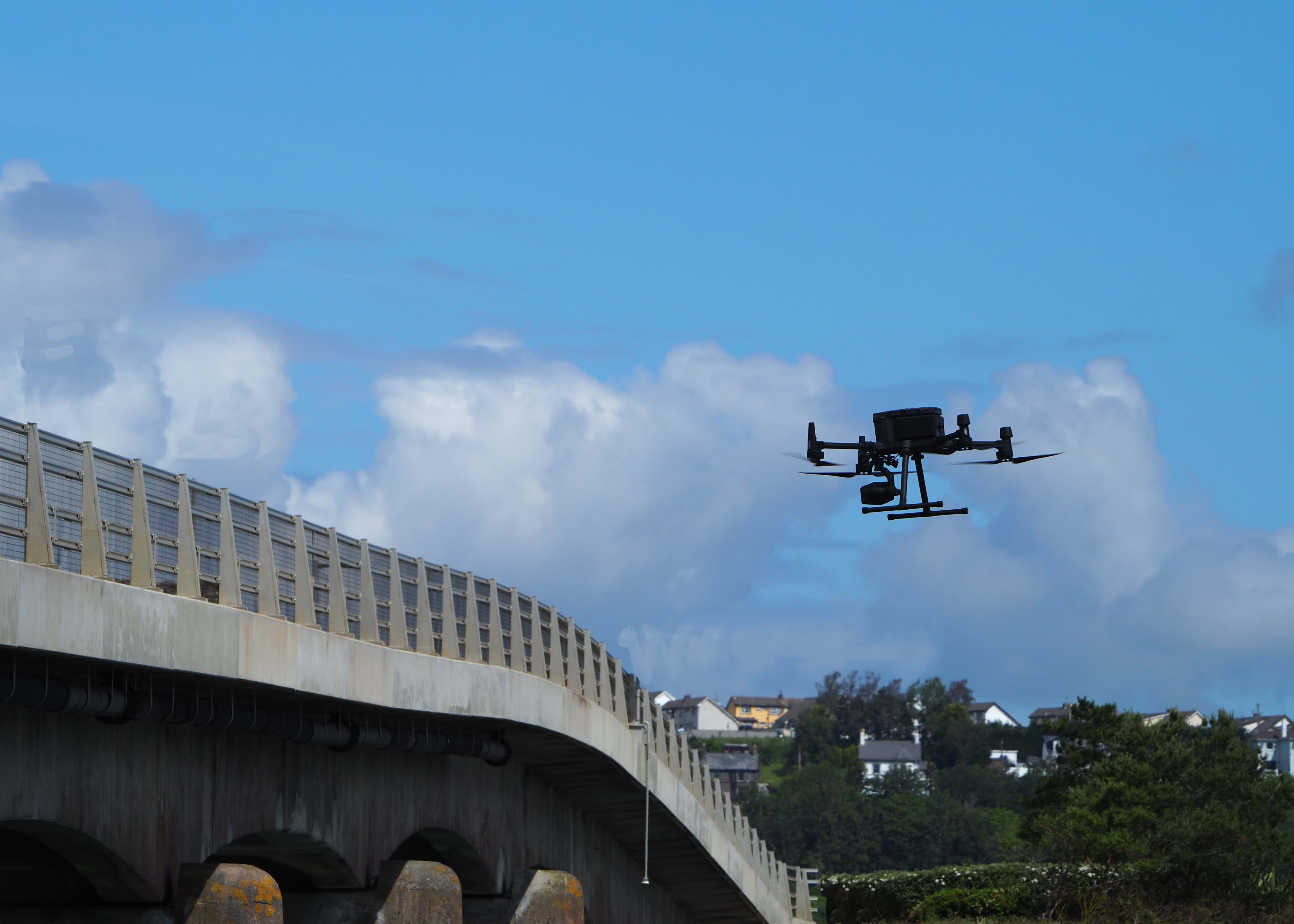 A drone inspecting a bridge