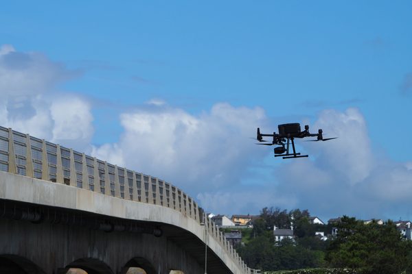 A drone inspecting a structure for insurance assessment