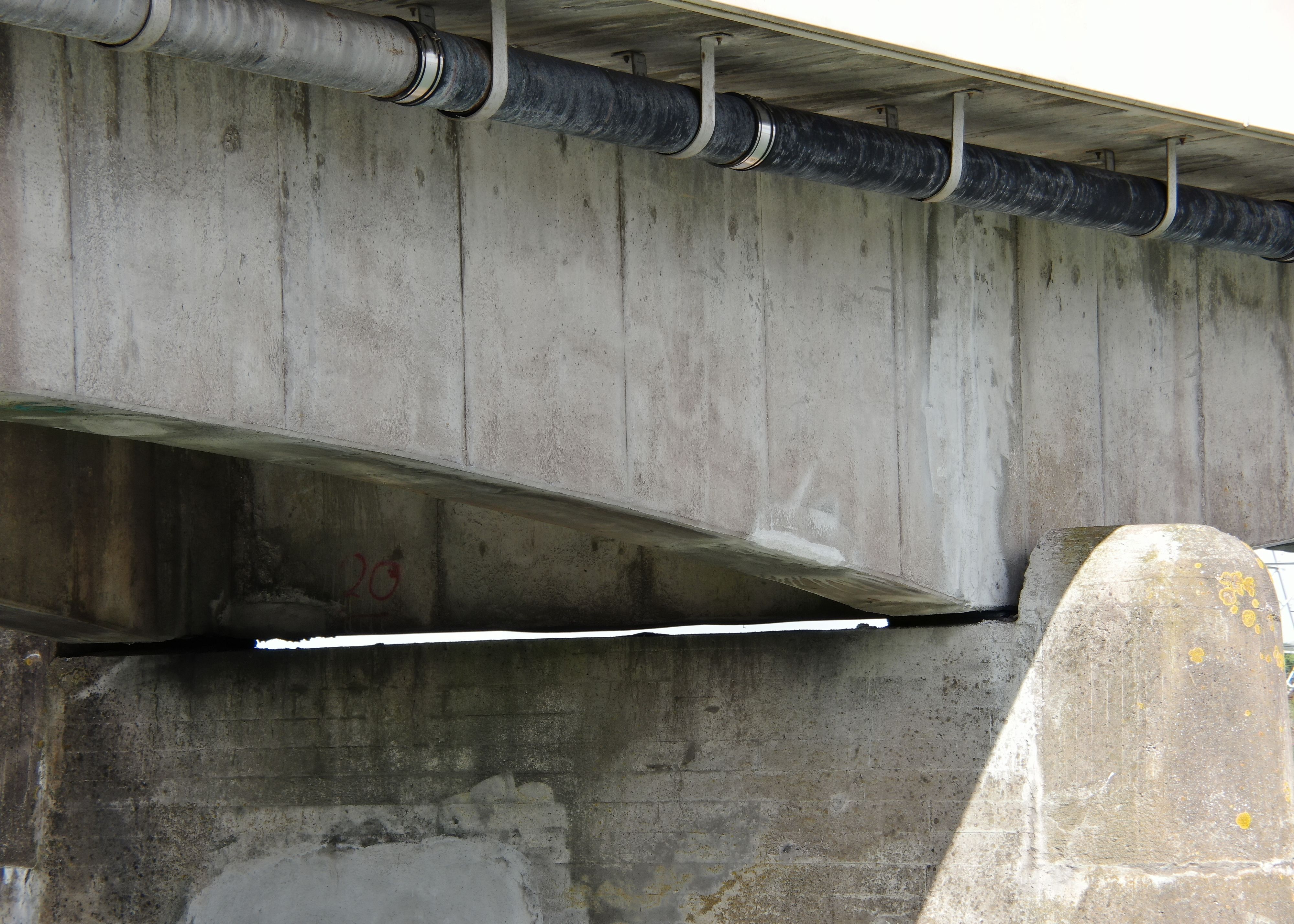 A concrete bridge being inspected