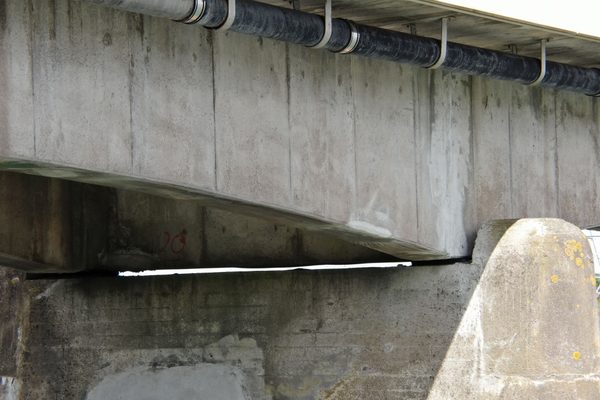 A concrete bridge being inspected