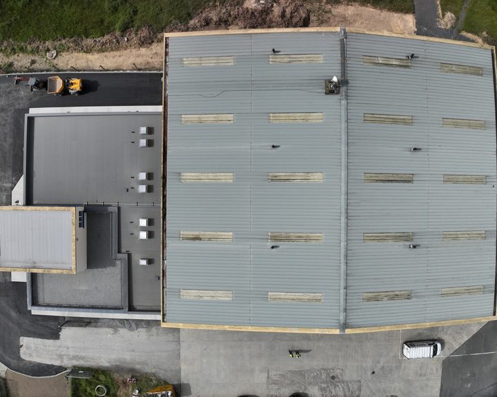 Aerial view of the steel-clad hangar building at Waterford Airport, with the two large doors at the front of the building
