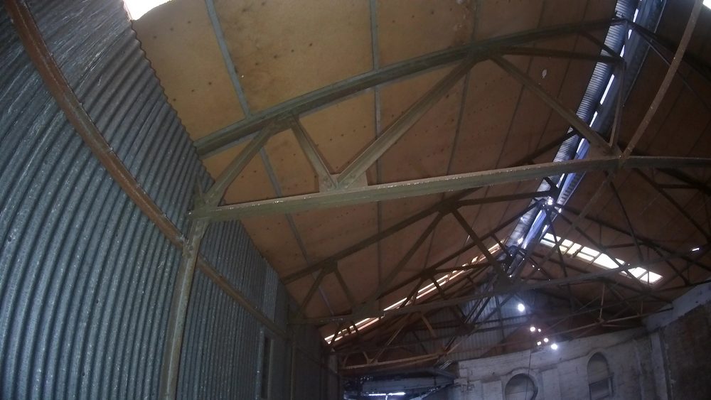 Interior of the old bakery showing the original 1960s industrial ovens still in place decades after the building was abandoned