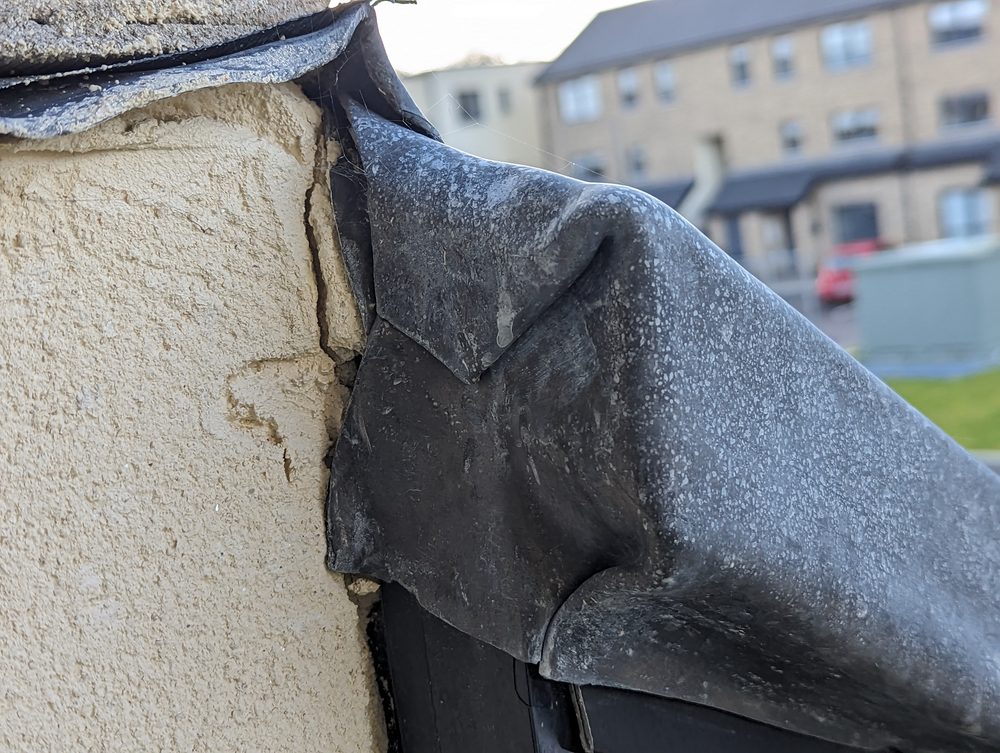 A further example of defective flashing documented during the inspection