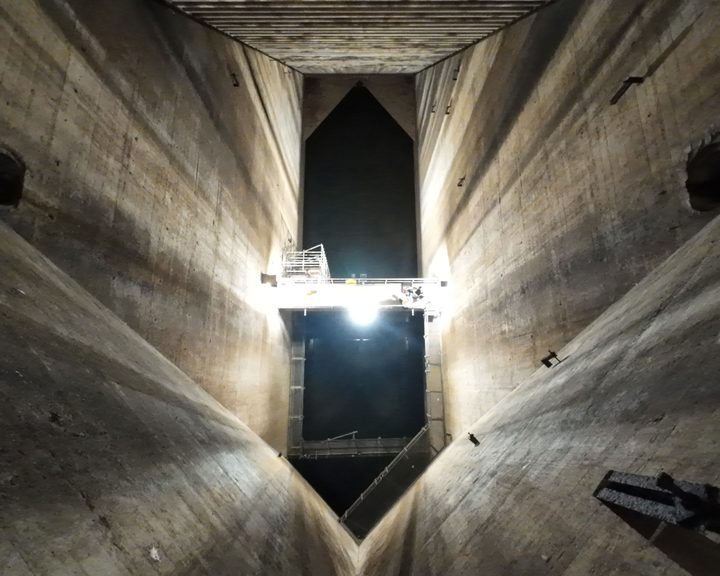 Interior view of a spillway at Inniscarra Dam showing the concrete flat construction