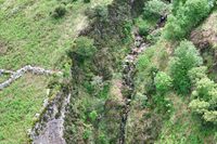 Detailed view of erosion features along the roadside