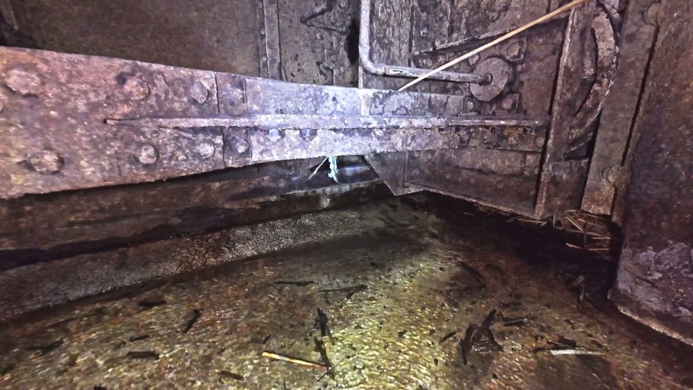 The expansion joint partway down the drained penstock at Ardnacrusha, showing riveted steel plate