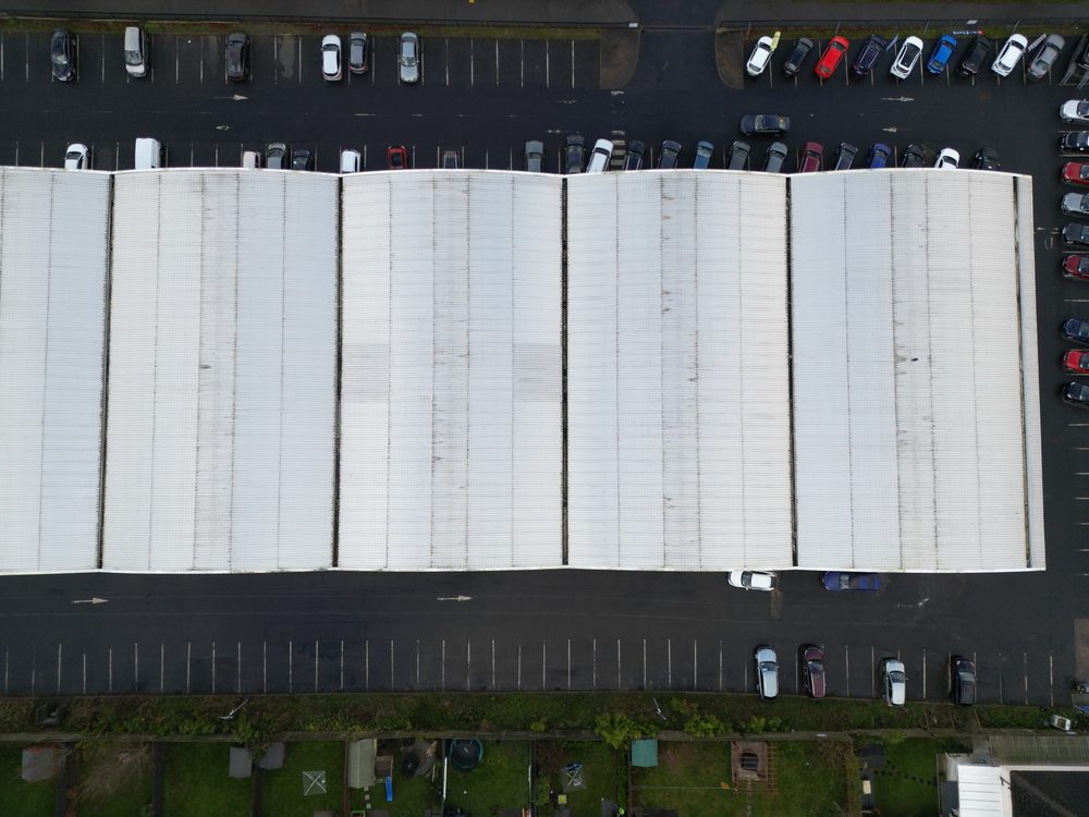 Drone view across the rooftops of the Co. Carlow shopping estate showing the varied roof profiles and building layout surveyed during the inspection