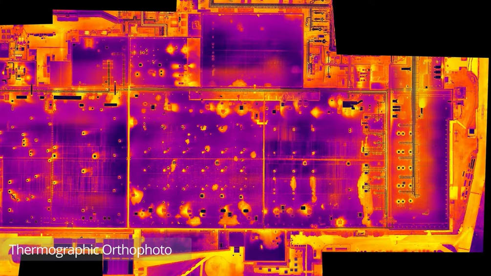 Thermographic orthophoto showing numbered water ingress defect locations across the commercial roof