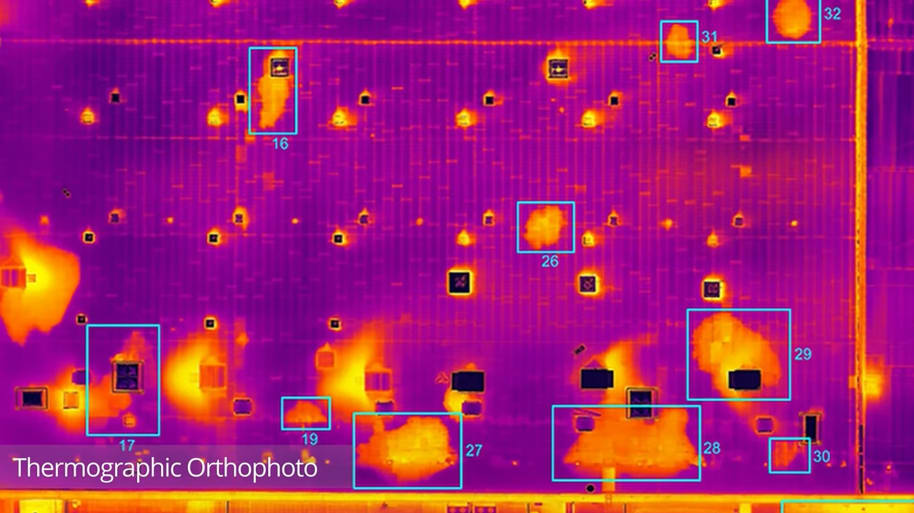 Ultra close-up thermographic orthophoto showing water ingress inkblot patterns across roof sections