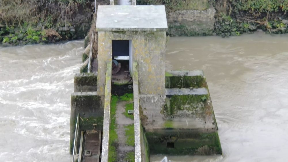 High-angle oblique view of the central control cabin and concrete walkway