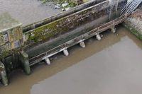 Oblique aerial view of the barrage structure and riverbanks
