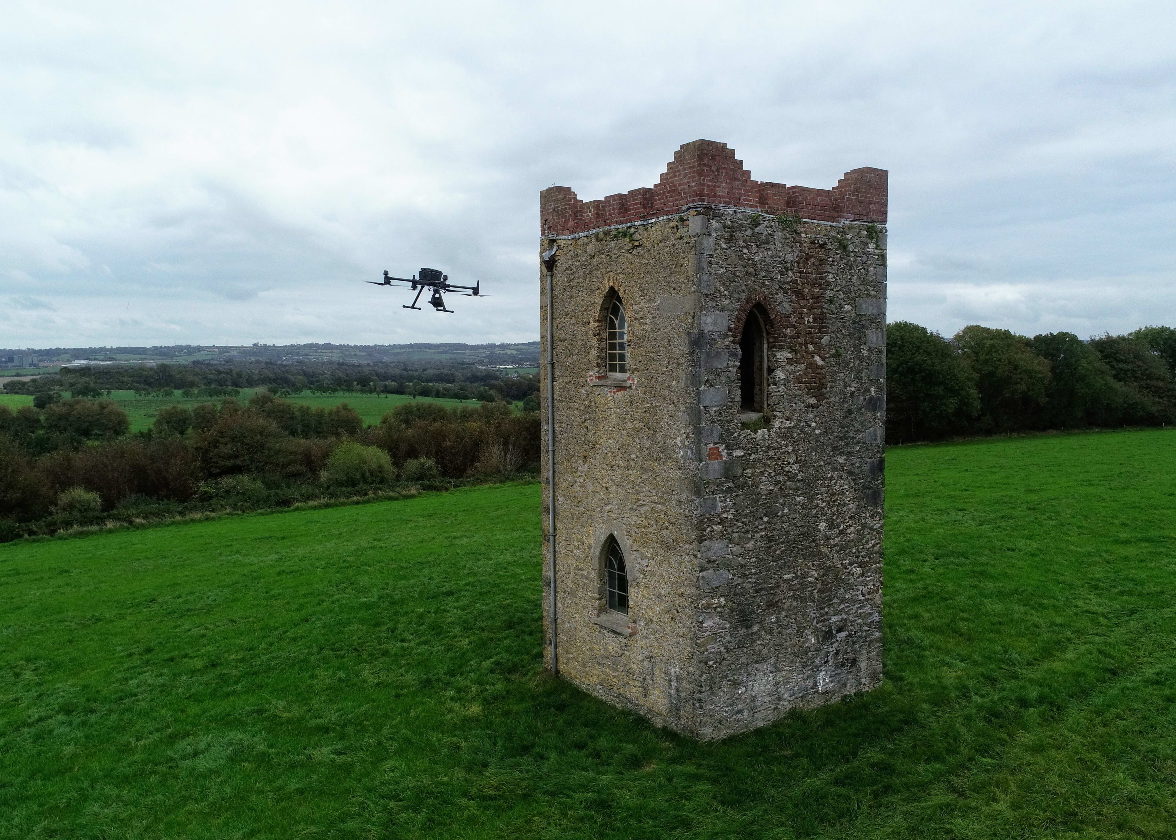 An old castle being inspected by a drone