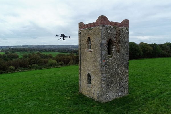 An old castle being inspected by a drone