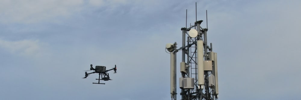 A drone performing an inspection of a cell phone tower in Ireland.