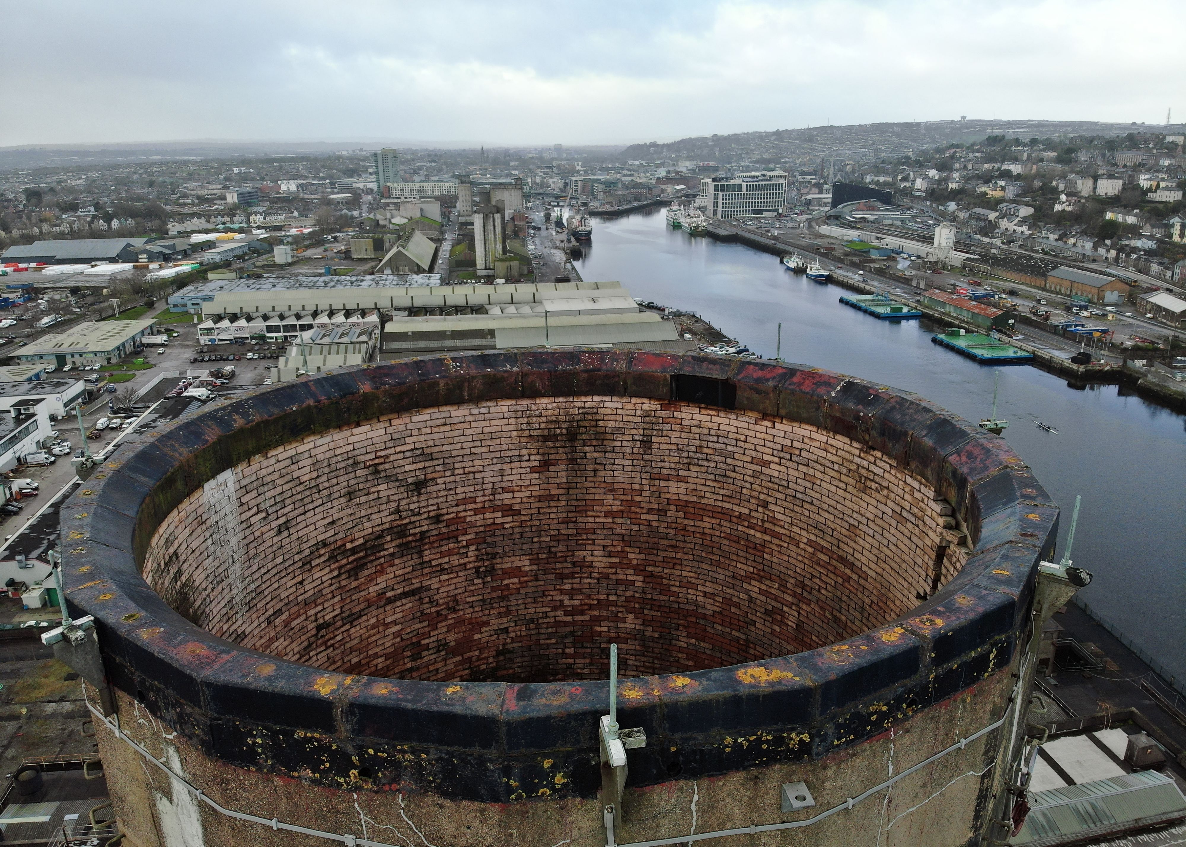 A concrete chimney stack being inspected