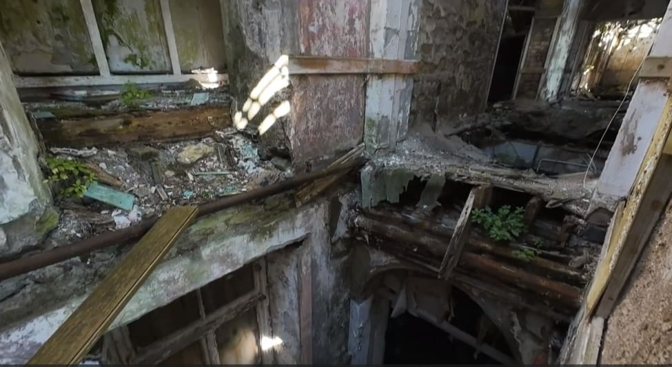 Drone footage of collapsed floor with missing joists