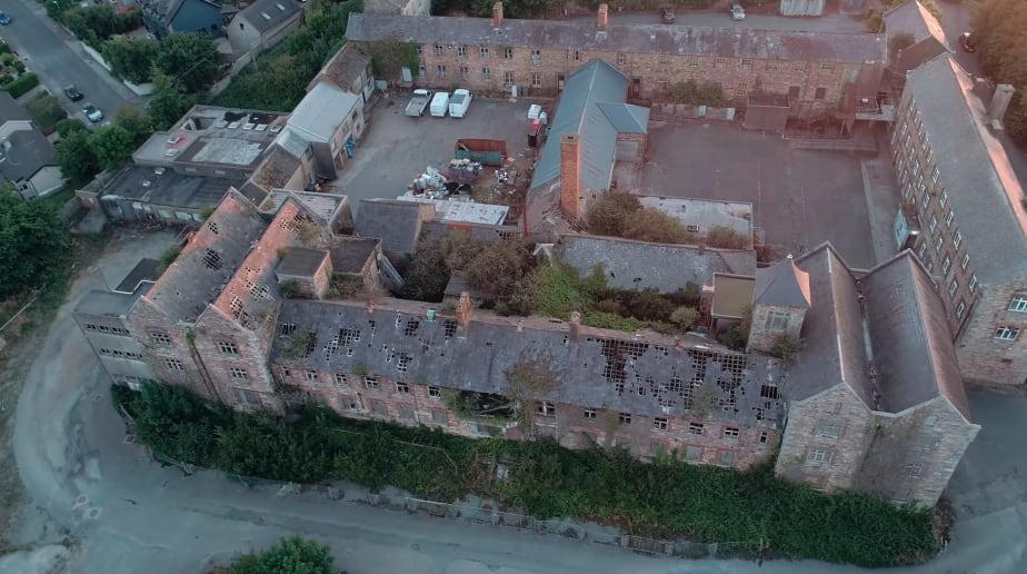 Full aerial view of derelict hospital building