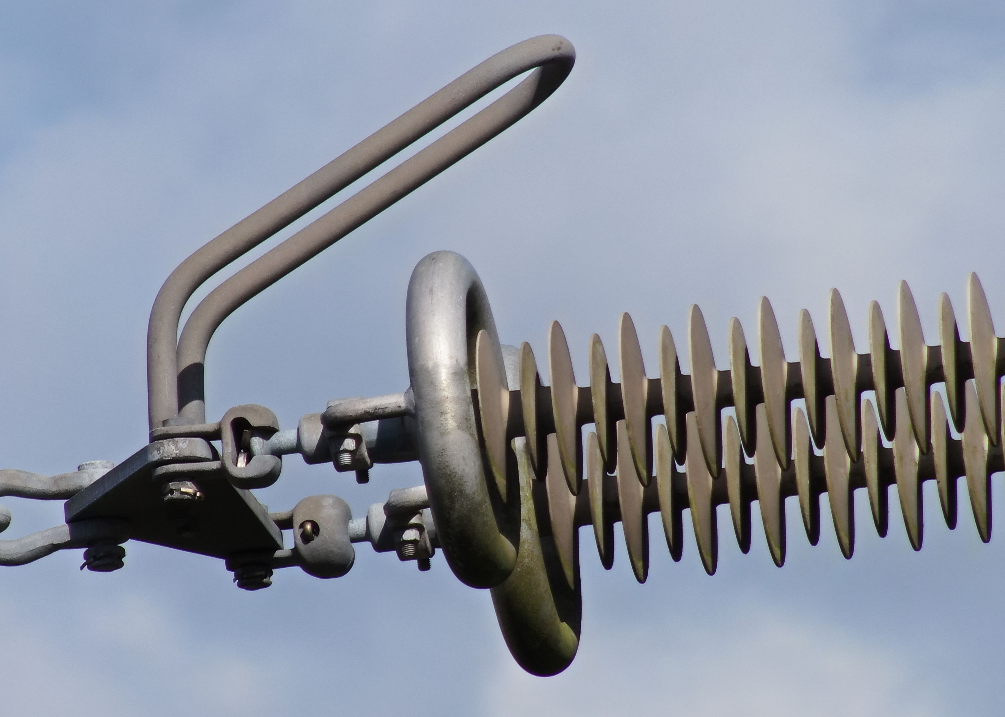 A detailed photo of the insulators on an electrical pylon