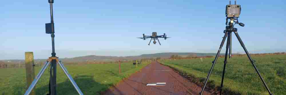 A drone with an RTK base station conducting a farm mapping project