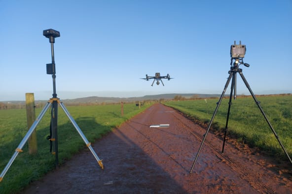 A drone with an RTK station heading off on a photogrammetry mission