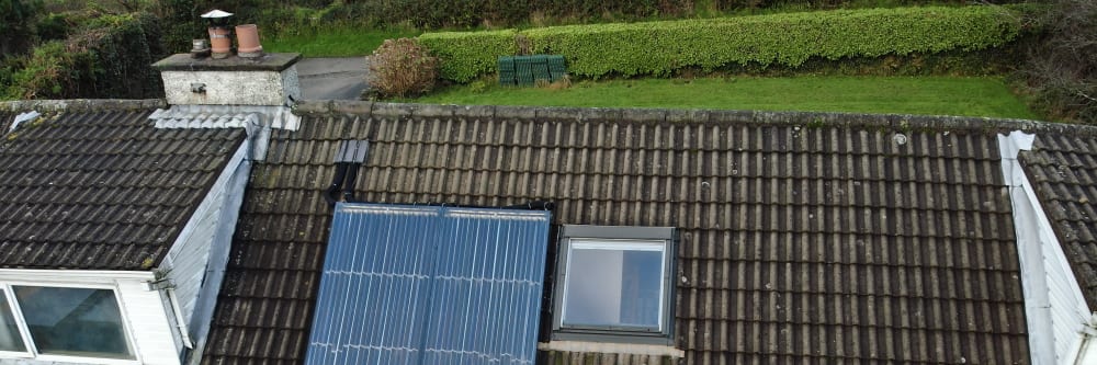 Solar panel on a roof inspected by a drone