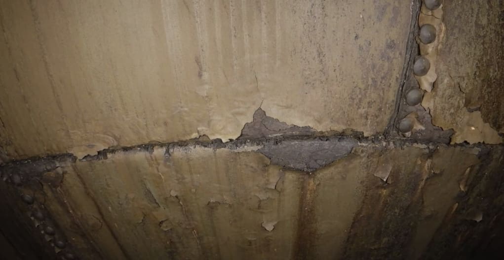 Corrosion visible on bolted panel surfaces and joints