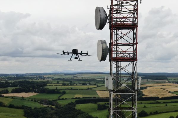 A large communications tower photographed by a drone