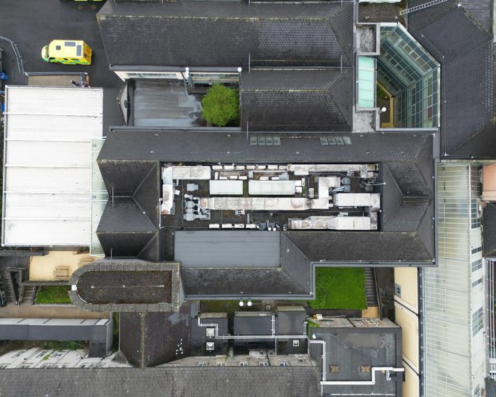 Aerial view of Naas Hospital showing the mix of older and newer buildings across the campus