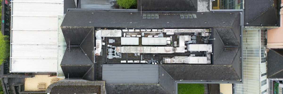 Aerial view of Naas Hospital showing the mix of older and newer buildings across the campus
