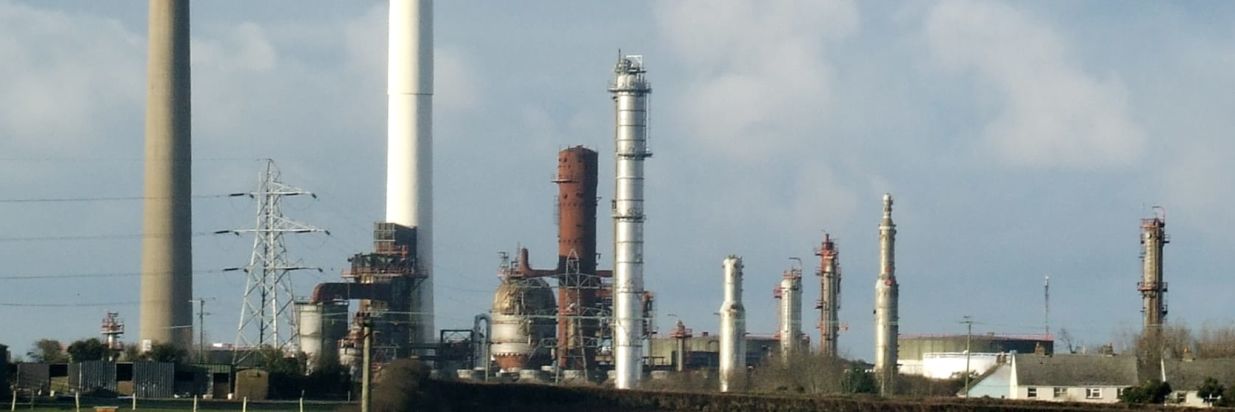 A photo of a load of industrial chimneys taken with a drone