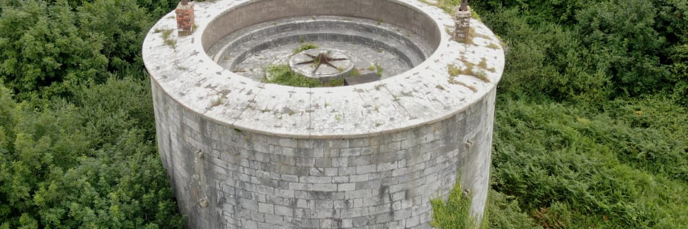 An old round martello tower building taken with a drone