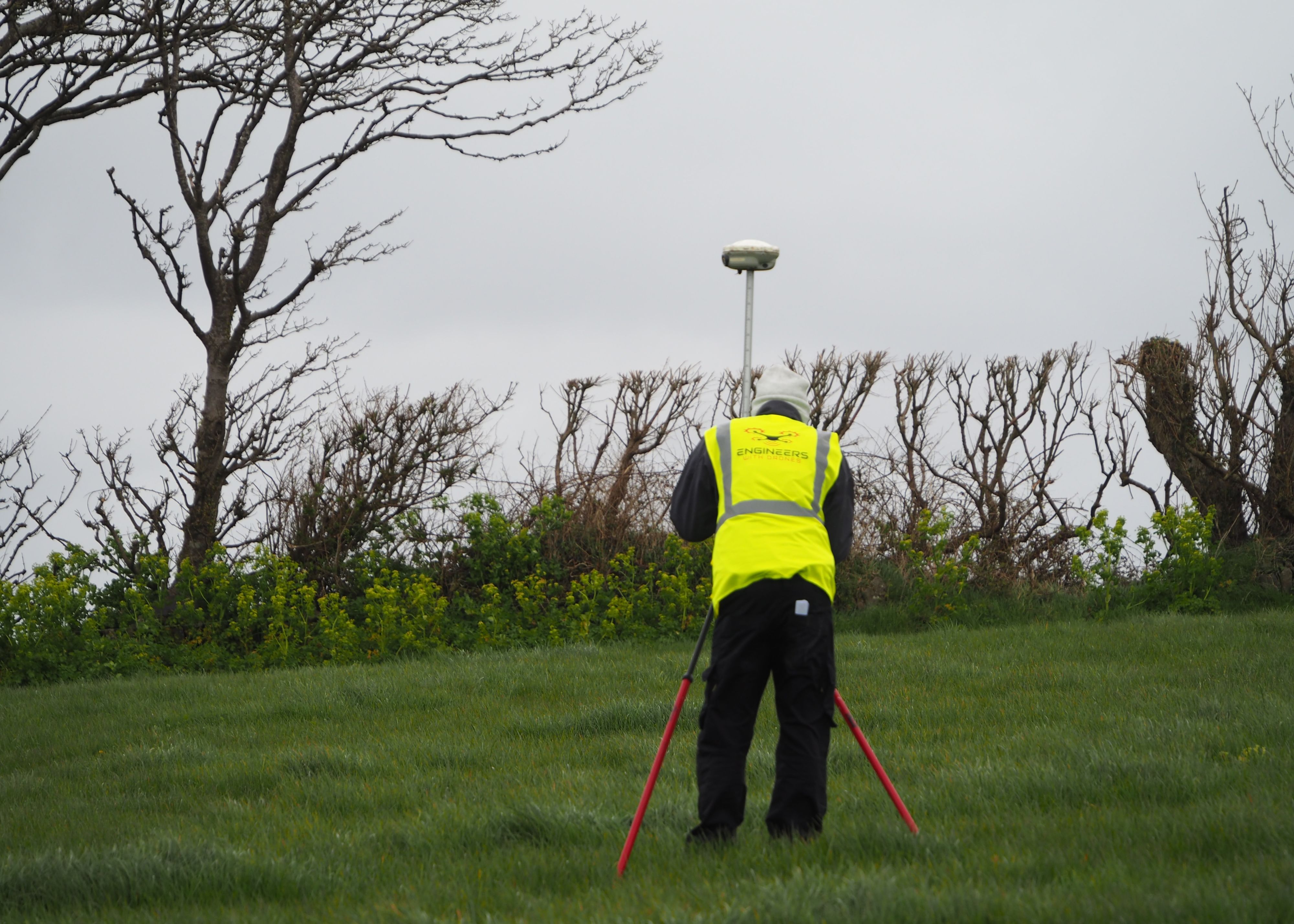 A person measuring GCP's on a farm mapping project