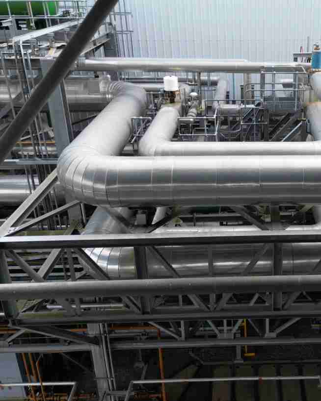 Pipes in a pipe rack being inspected with a drone