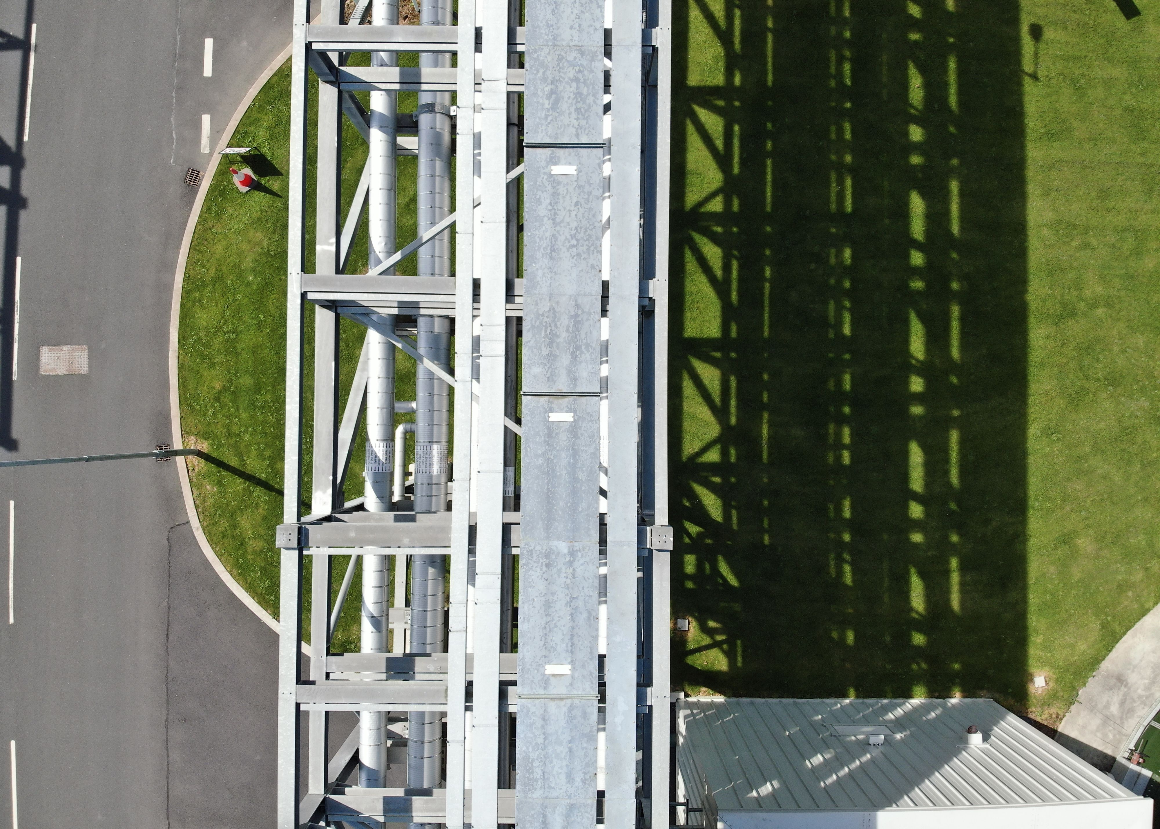 An aerial image of a pipe rack in a pharma facility