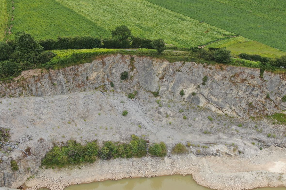 A rock face and stockpile in a quarry