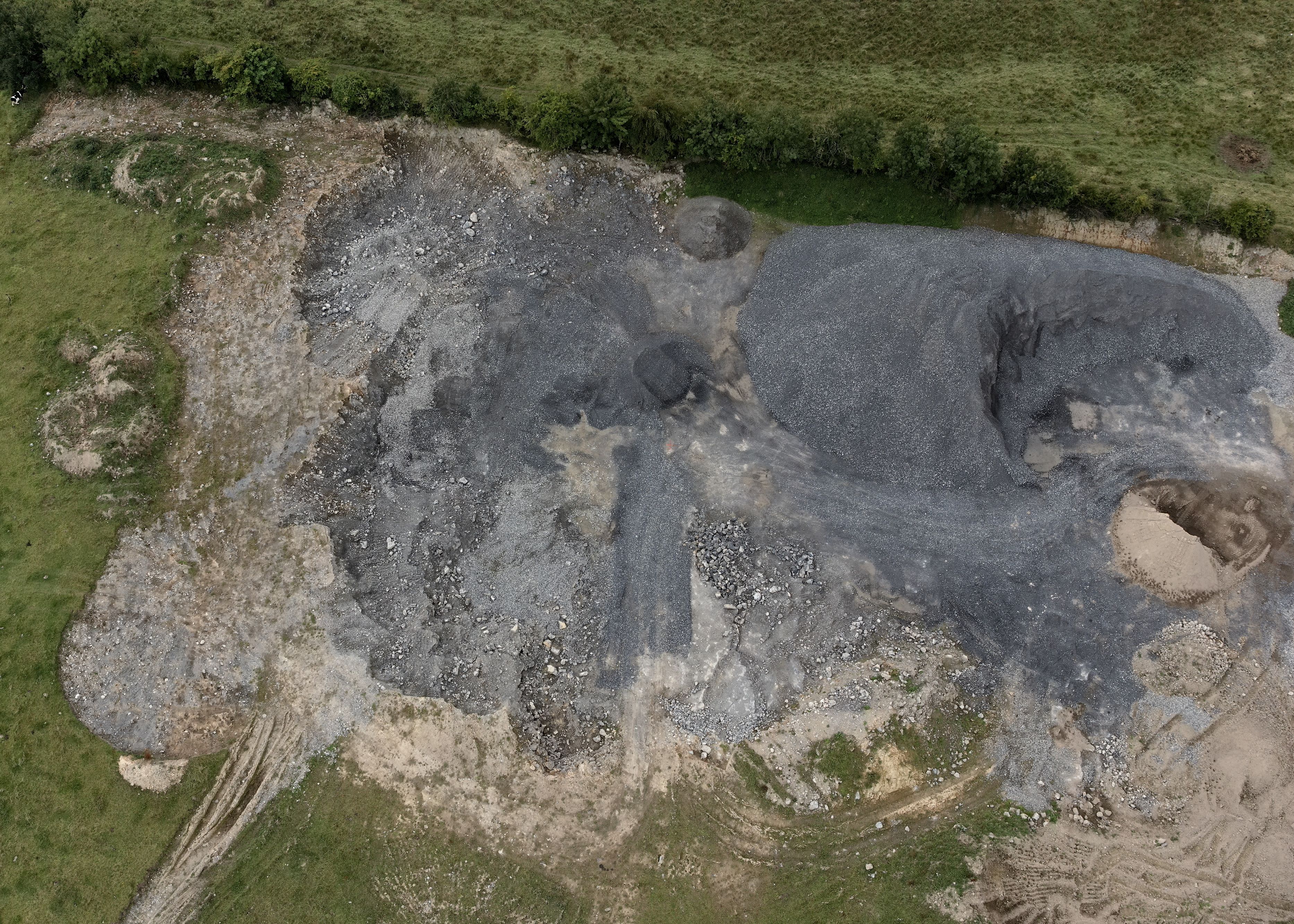 A quarry processing area being inspected bya  drone