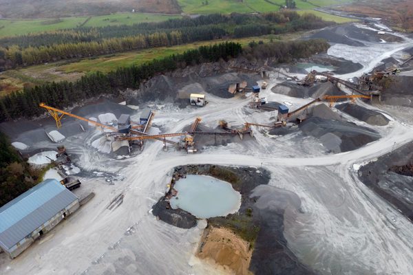 A quarry processing area being inspected bya drone
