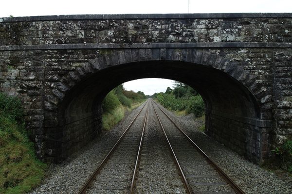 Railway line stretching into the distance, captured by drone