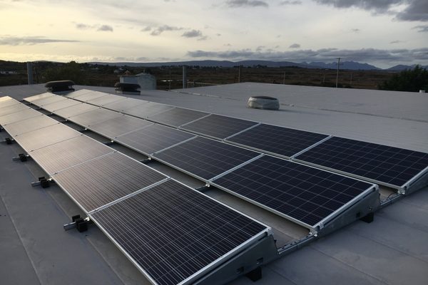 A rooftop solar array photographed by a drone during an inspection