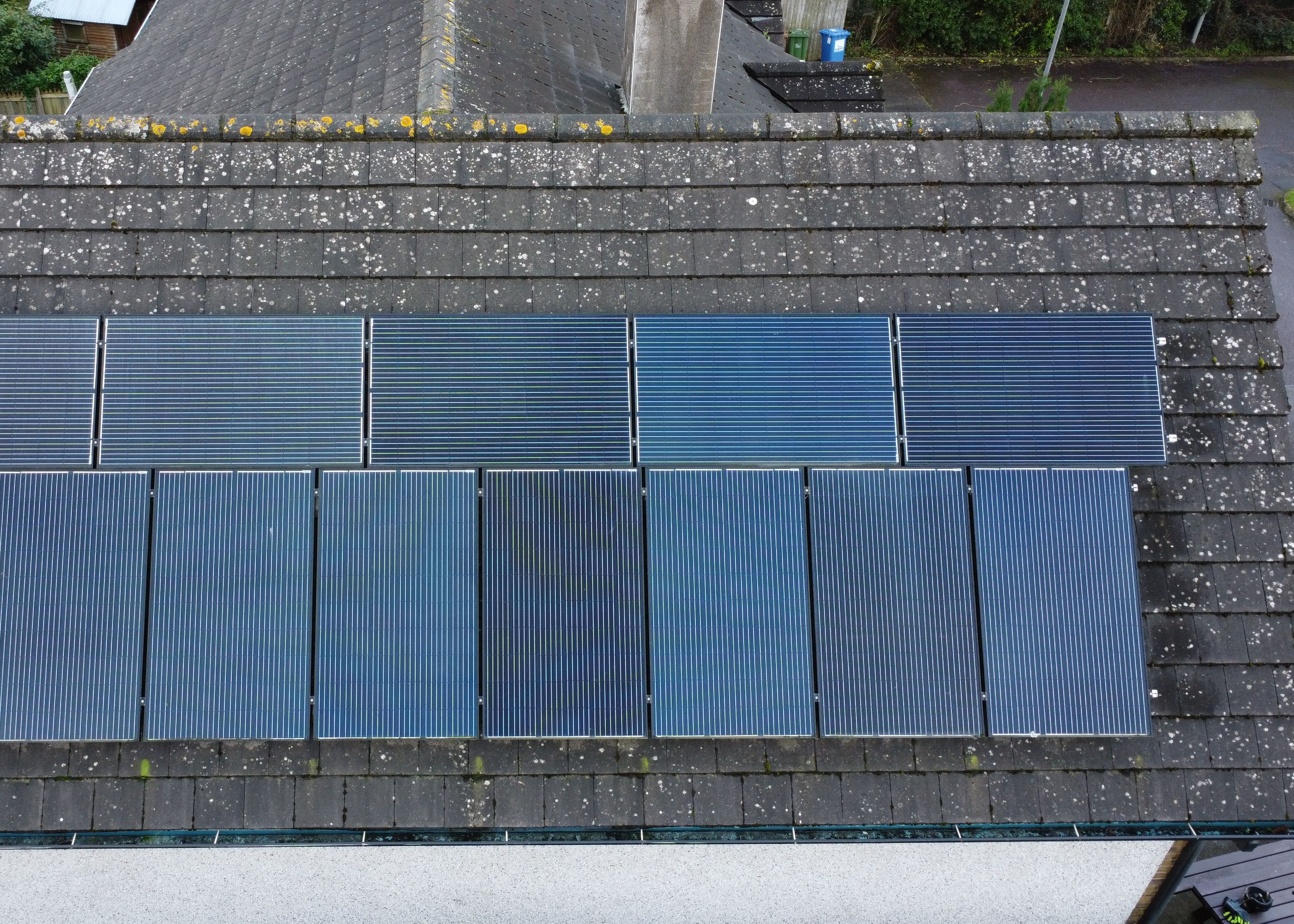 A PV solar array on a roof being inspected