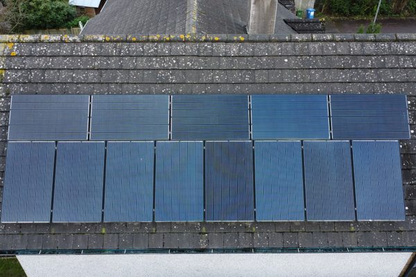 A PV solar array on a roof being inspected