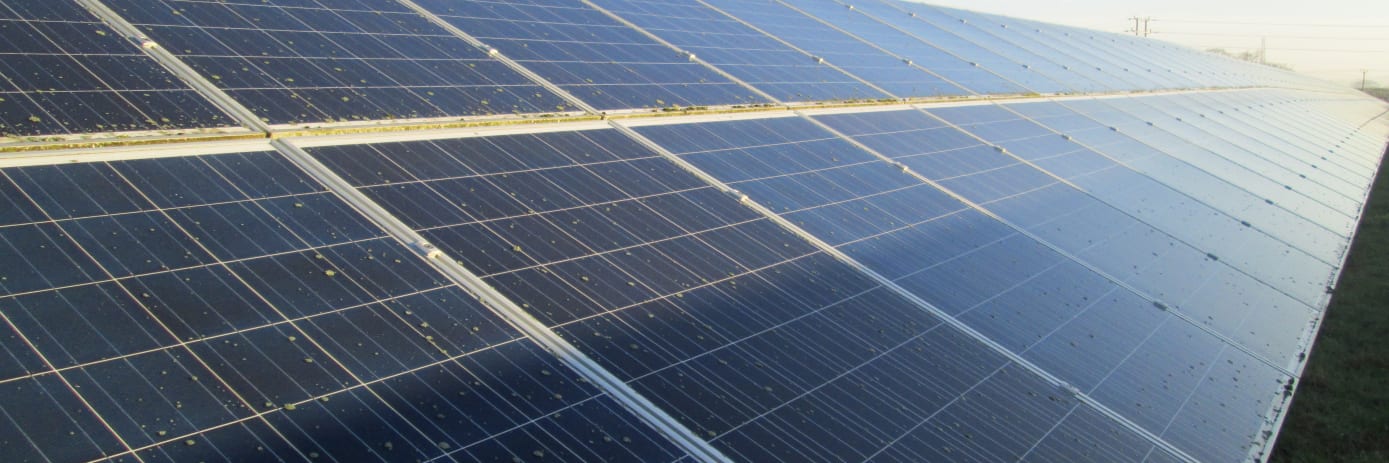 Solar panels being inspected by a drone