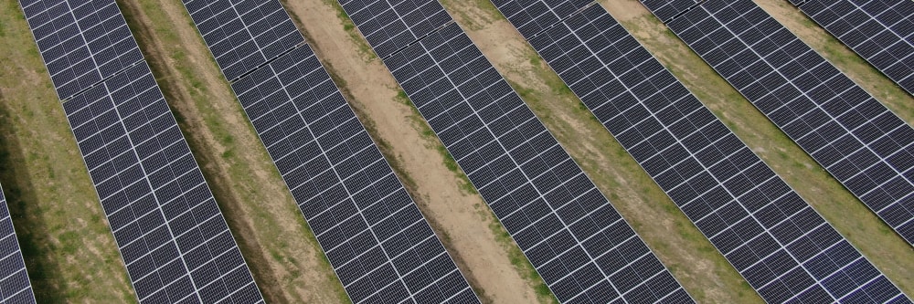 Solar panels being inspected by a drone