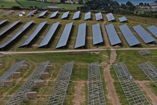 A partially completed solar farm under construction