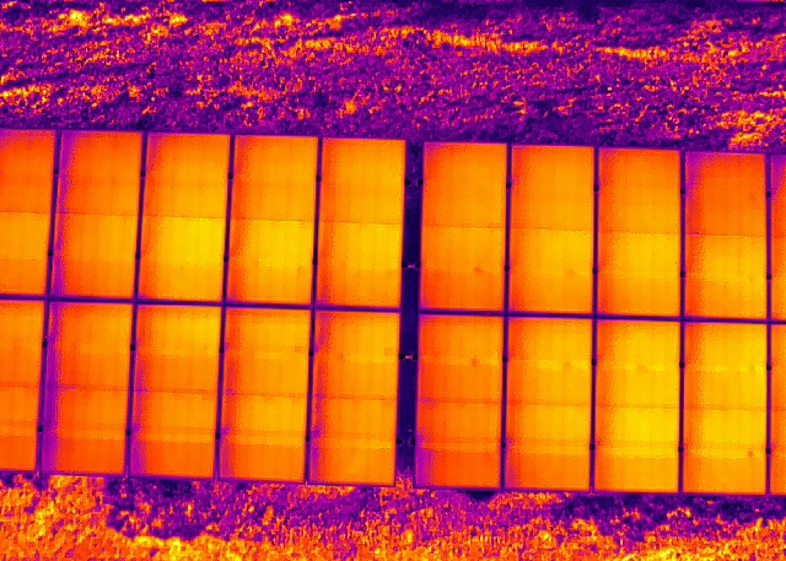 A thermal image of solar panels on a solar farm