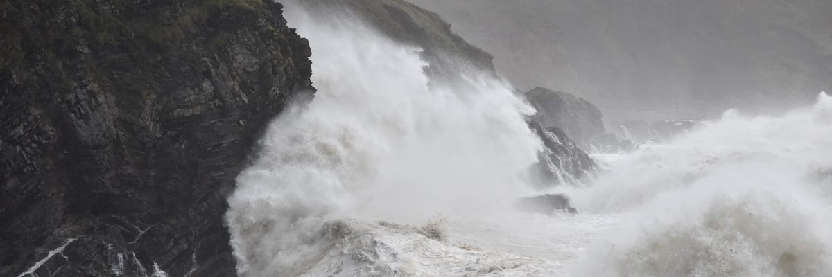 A drone capturing aerial imagery of a storm-damaged site in Ireland for post-storm damage assessment
