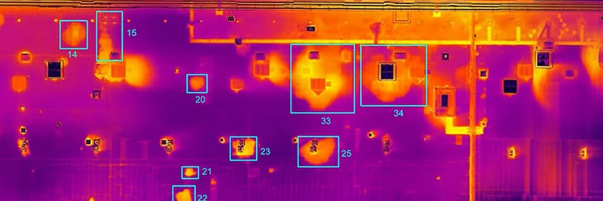 A thermographic orthophoto of a building roof showing differential heat retention across the surface