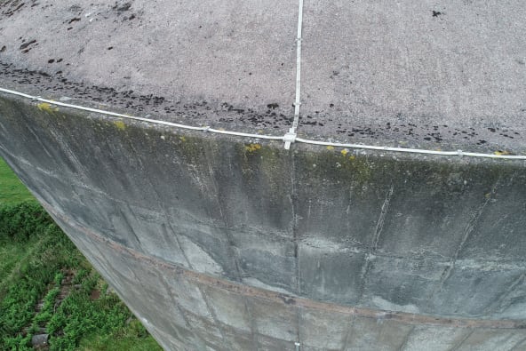 An image of the top of a large conical water tower